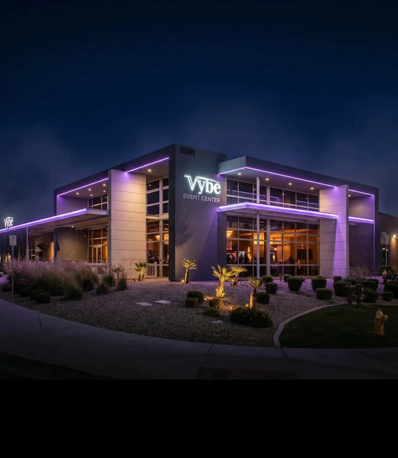 Building exterior at 2301 S. Stearman Drive, with a Vybe Event Center sign and purple lighting at dusk.